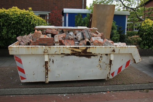 A professional team clearing a cluttered house in Camberley